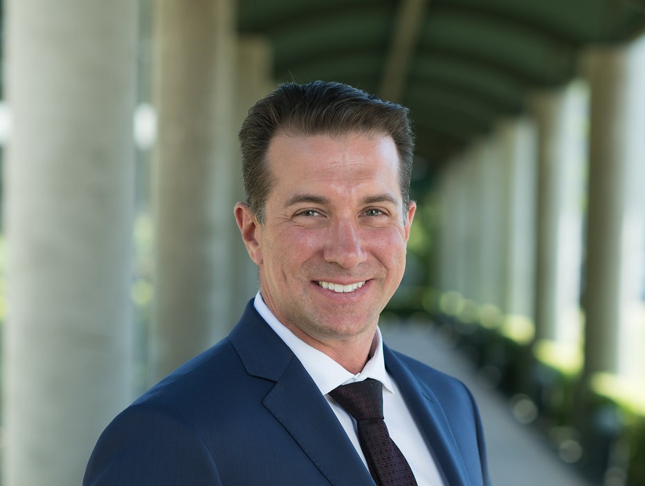 Brandon Frere professional portrait in a navy suit