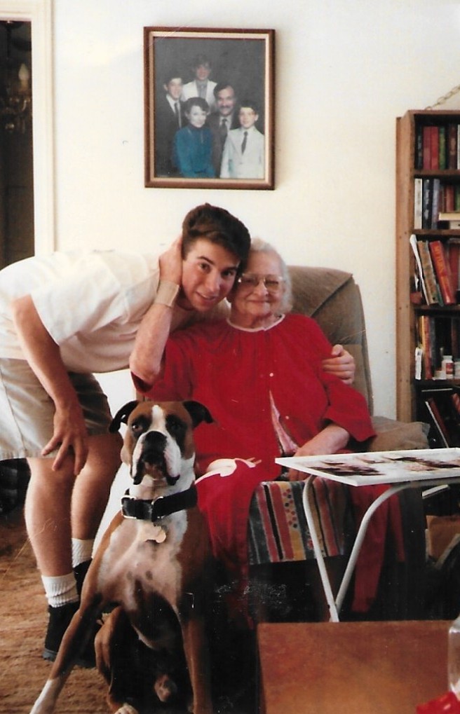 Brandon with his grandmother and the family boxer