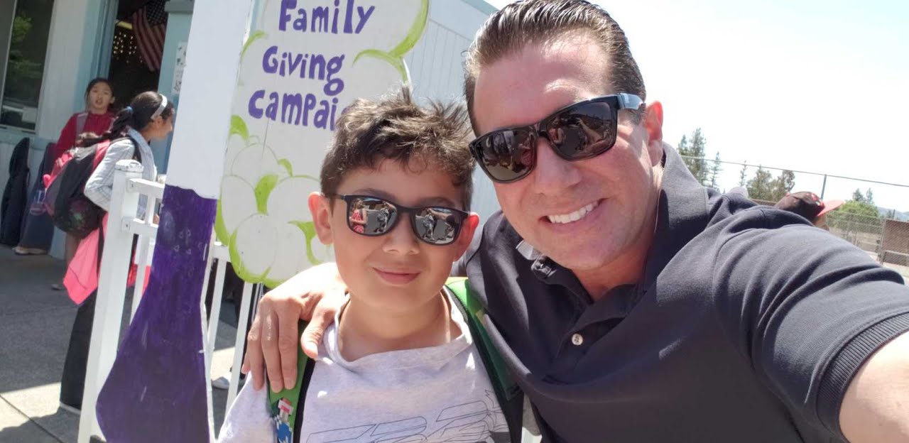 School drop-off with his son at the family giving campaign