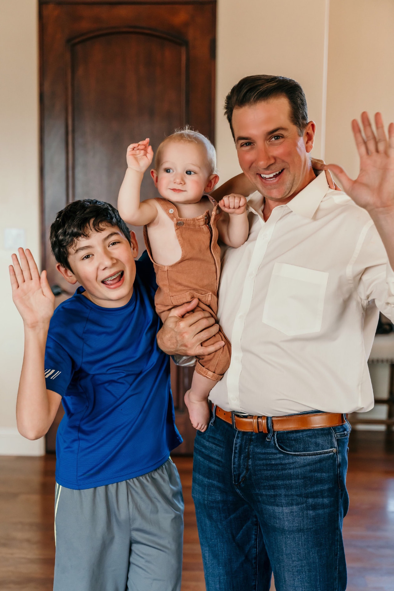 Brandon Frere with his two sons at home
