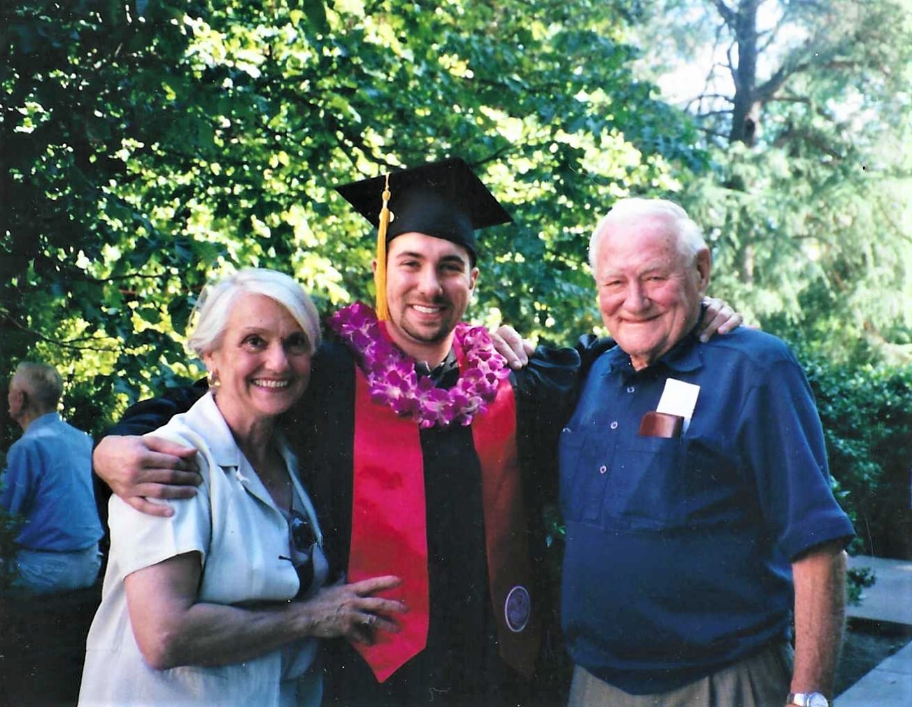 Graduation day with his grandparents