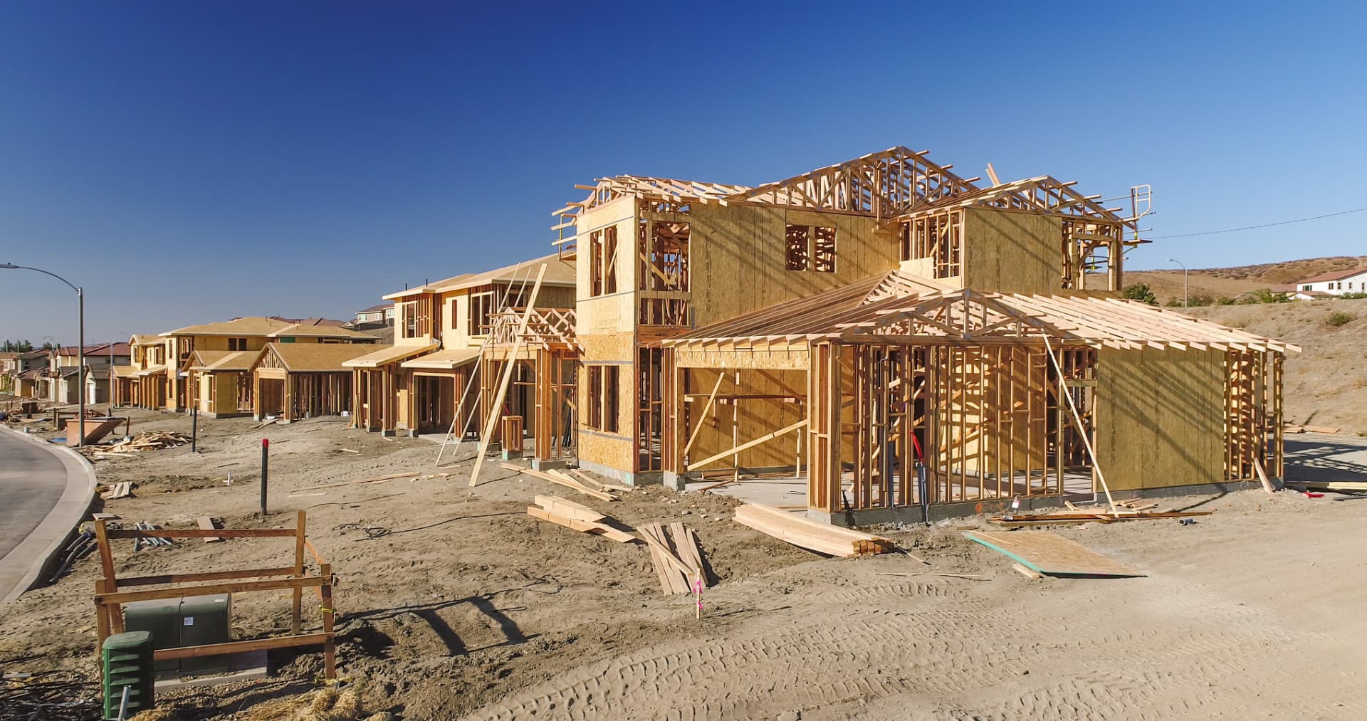 Homes under construction with exposed framing in a new subdivision